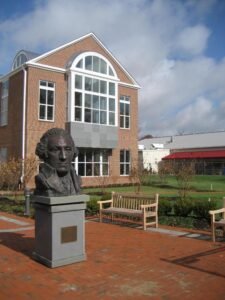 a statue of a man in front of a building