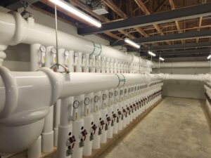 a row of white pipes in a building