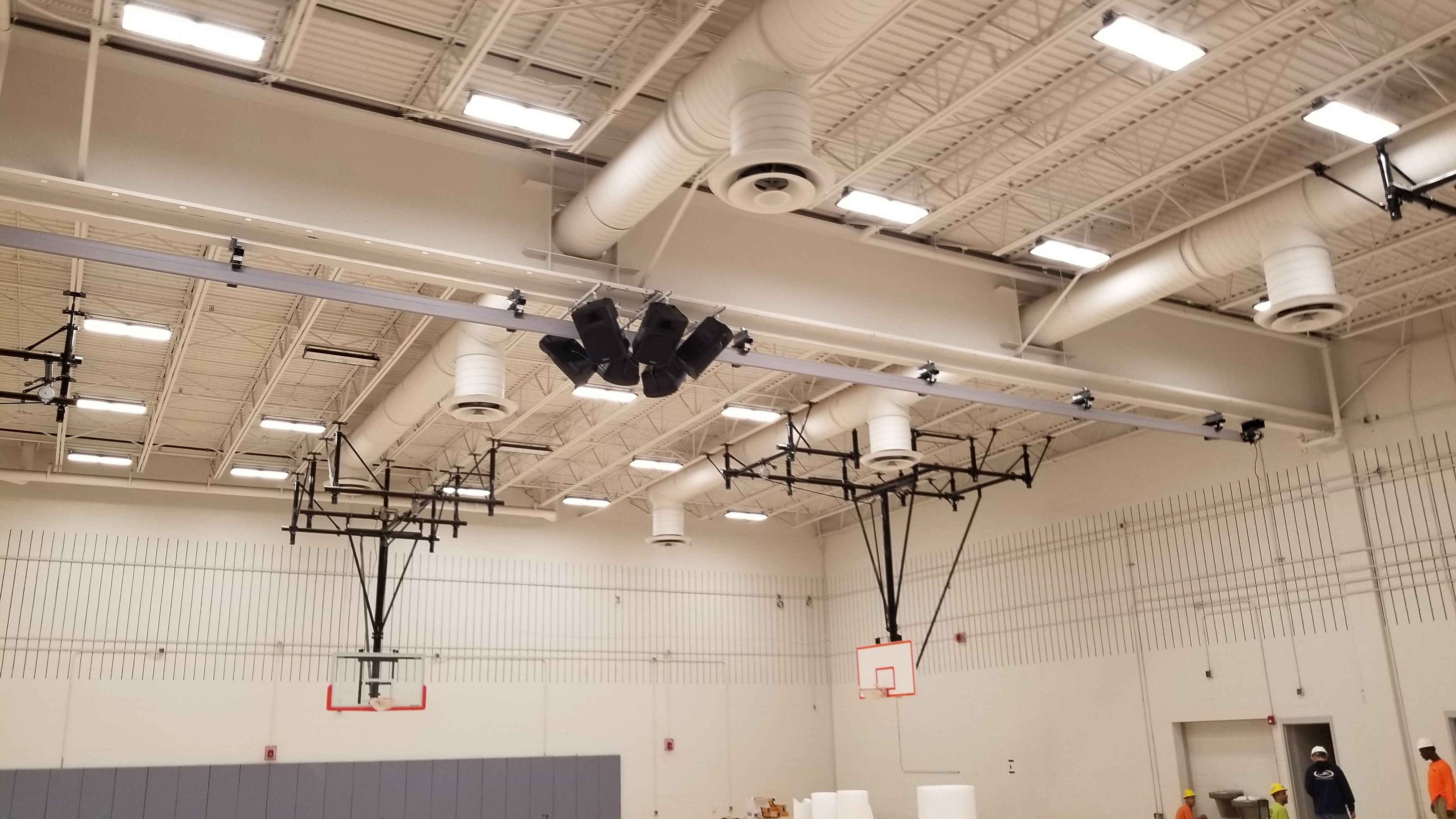 a large room with a bunch of lights hanging from the ceiling