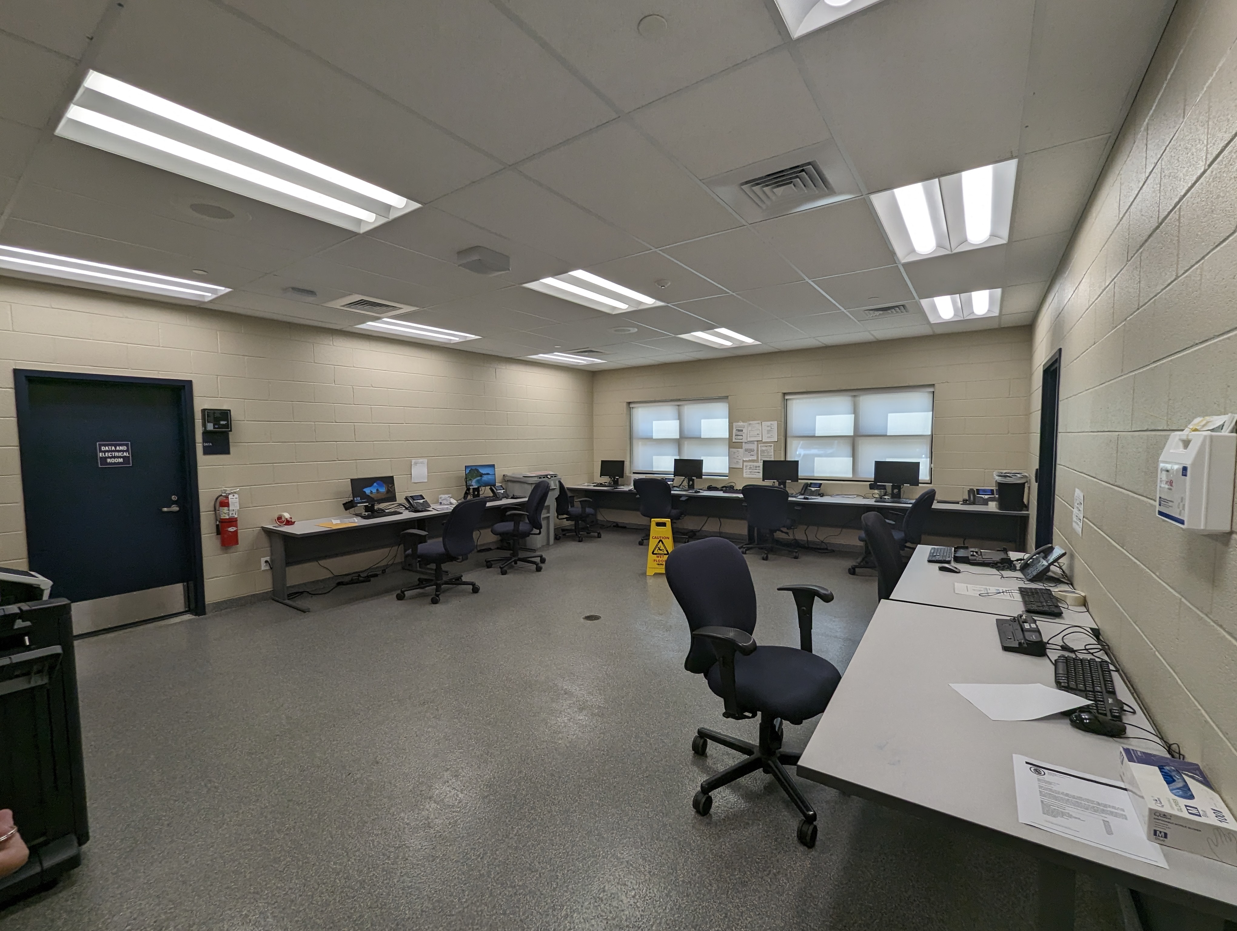 a large room with desks and computers in it