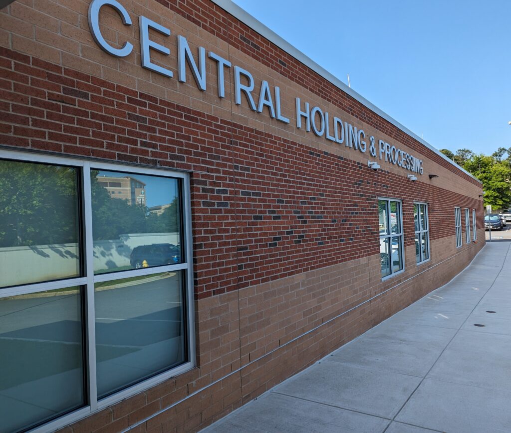 a brick building with a sign on the side of it