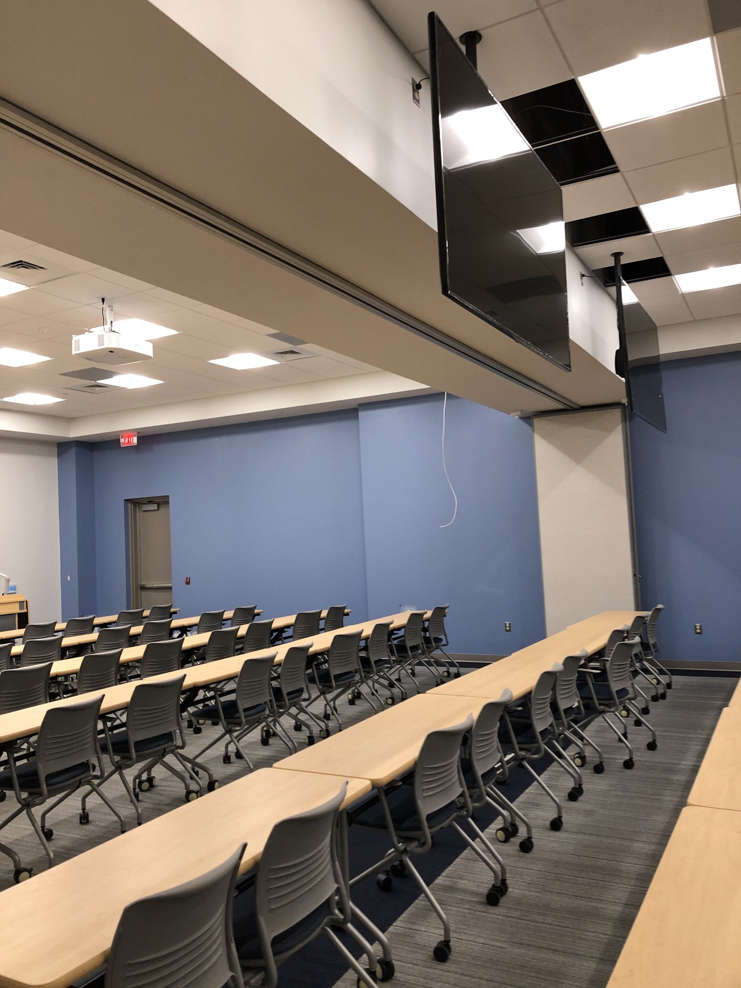 a large room with a long table and chairs