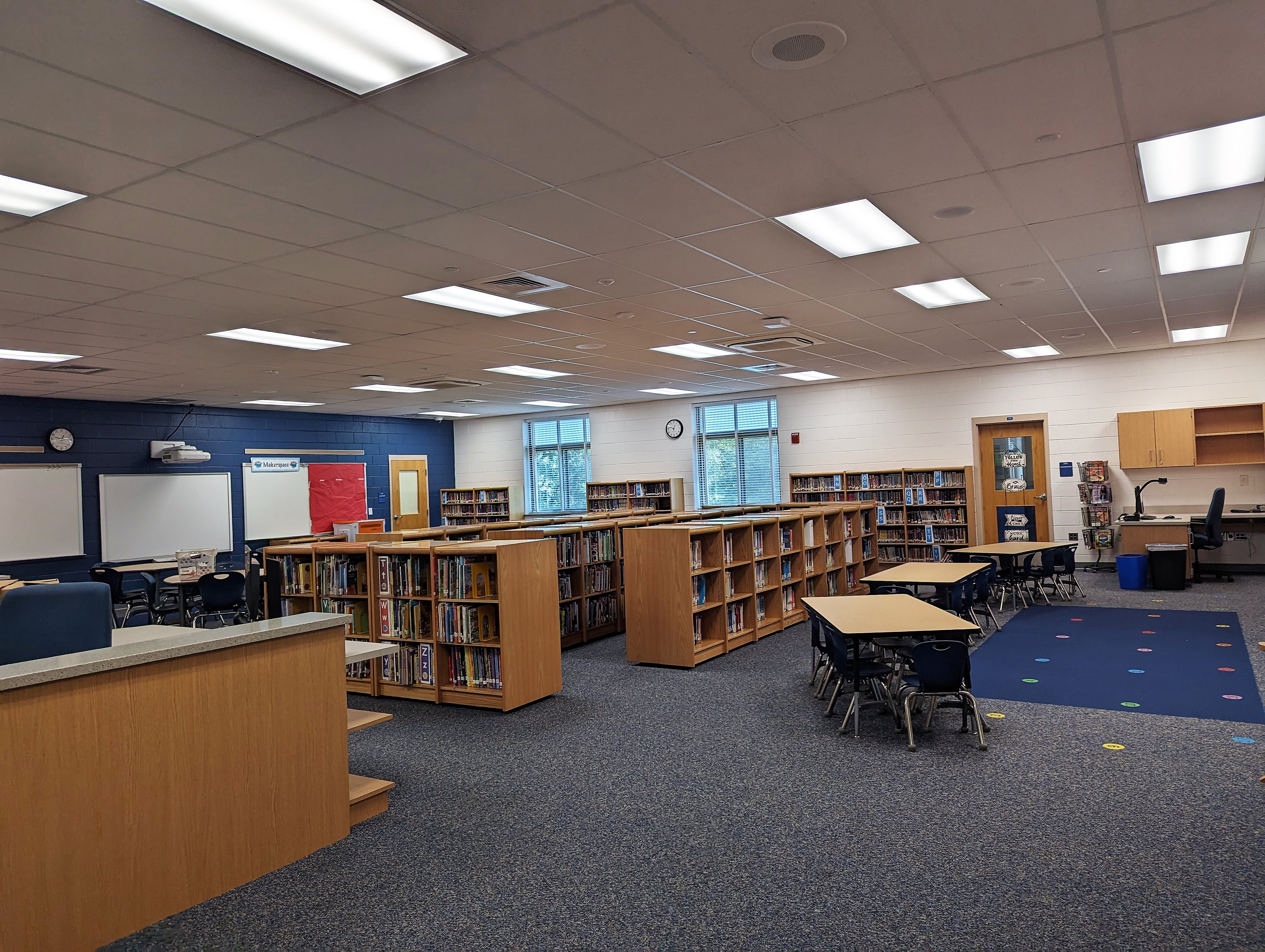 an empty library with tables and chairs