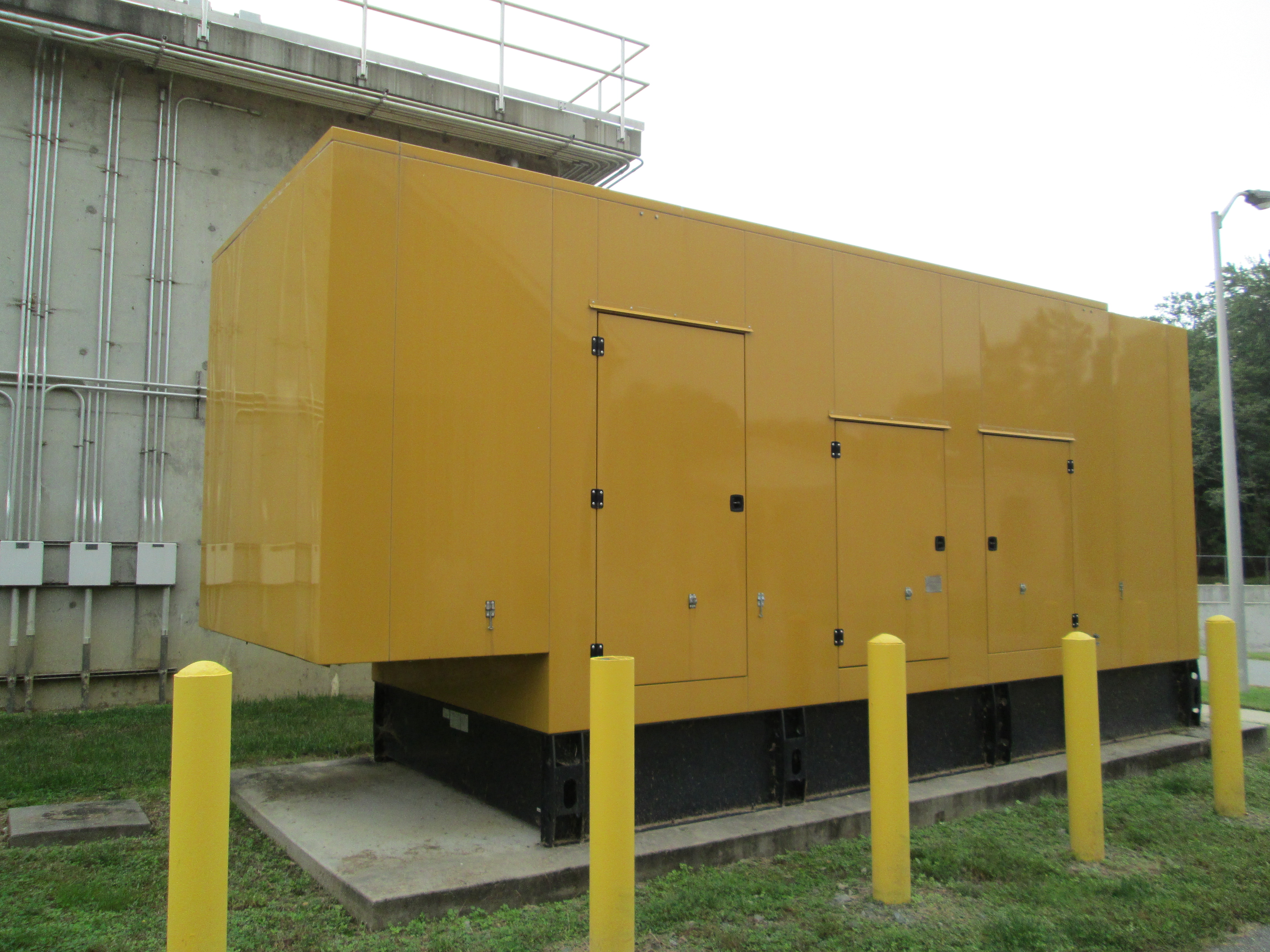 a large yellow box sitting in the middle of a field