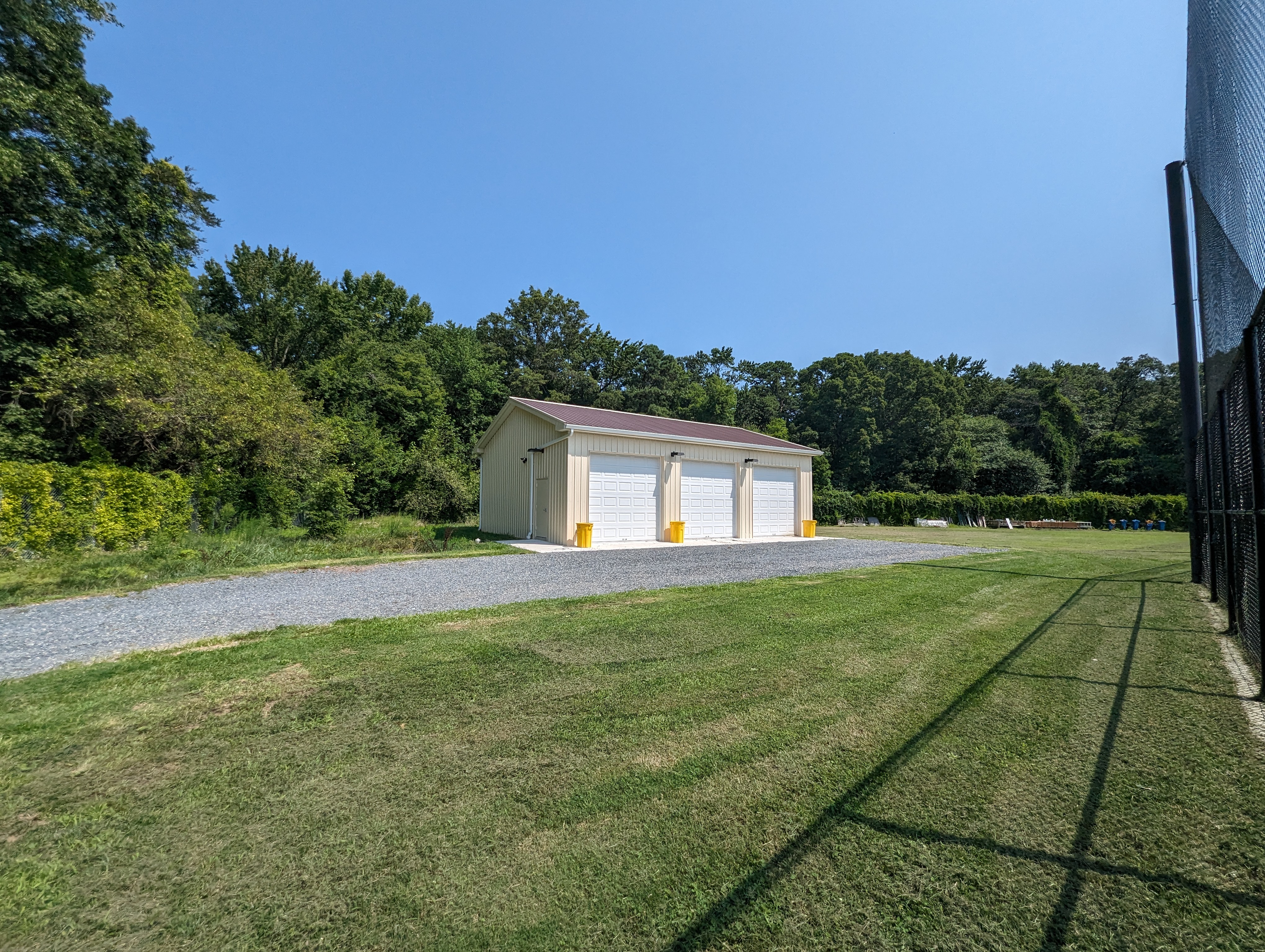 a driveway with a garage in the middle of it