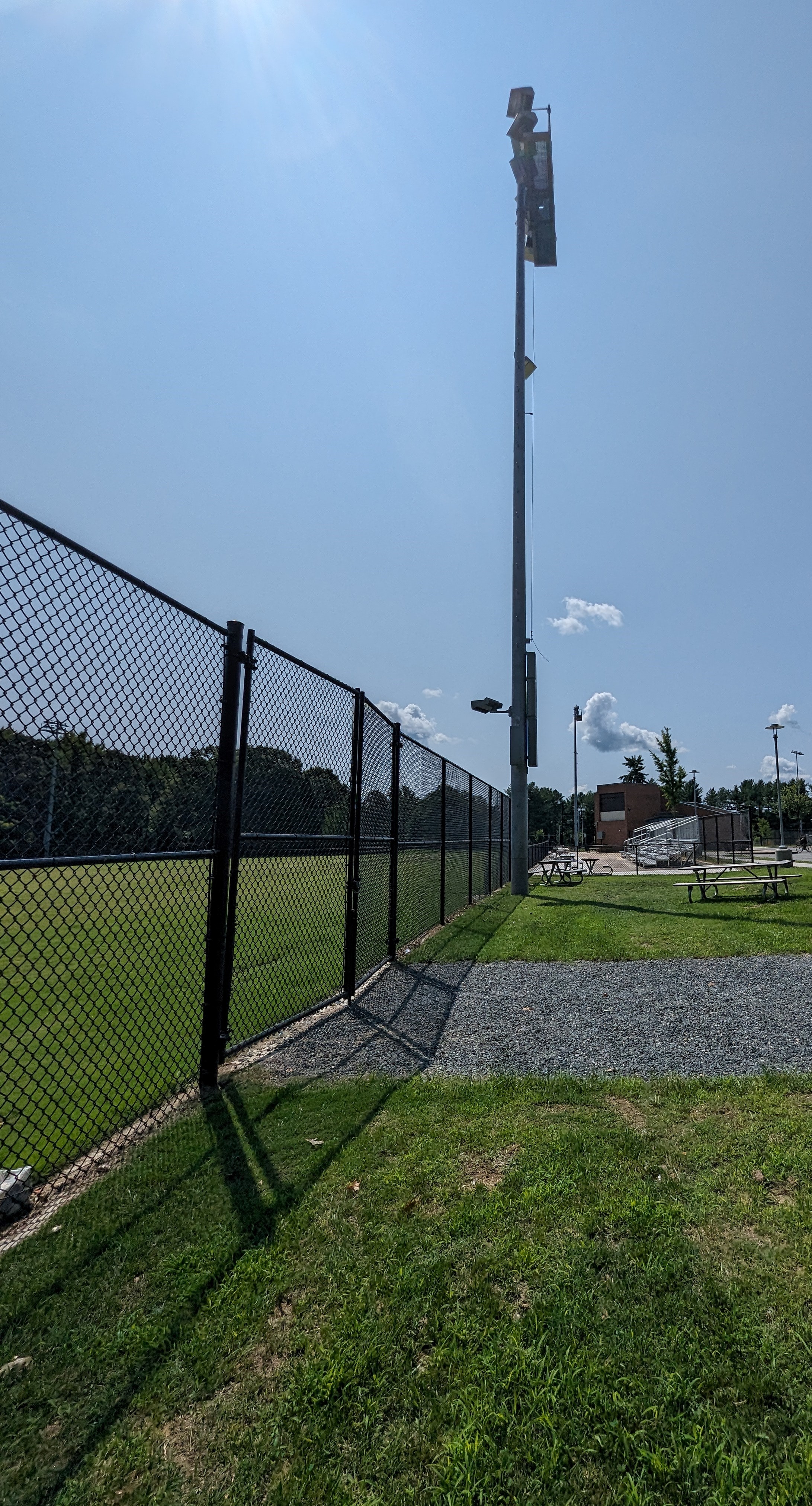 a tennis court with a fence surrounding it