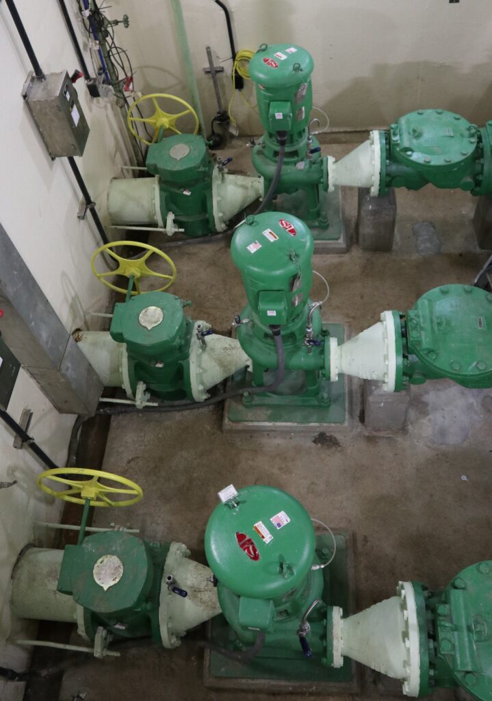 a group of green valves in a room