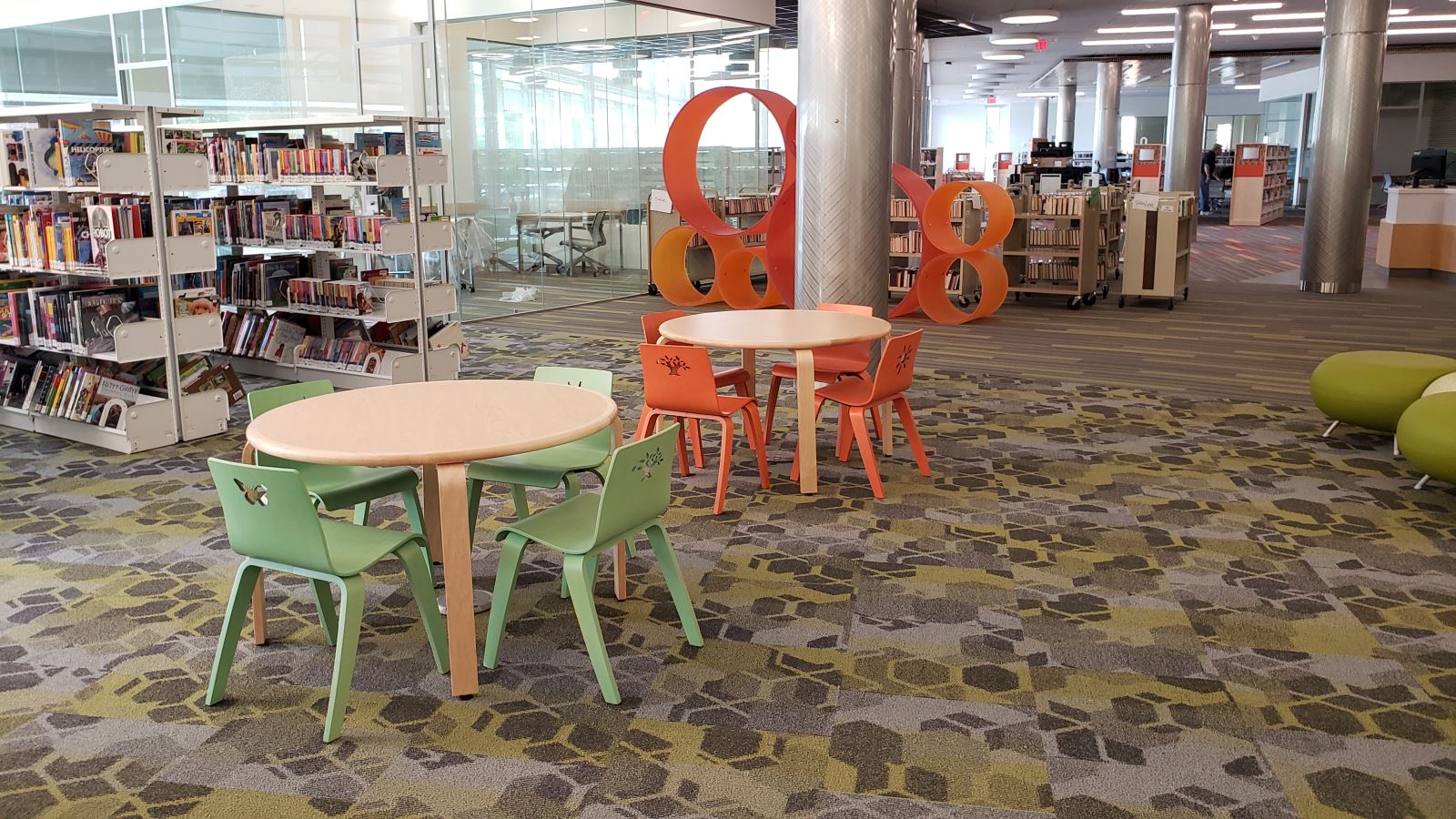 a library filled with lots of books and furniture