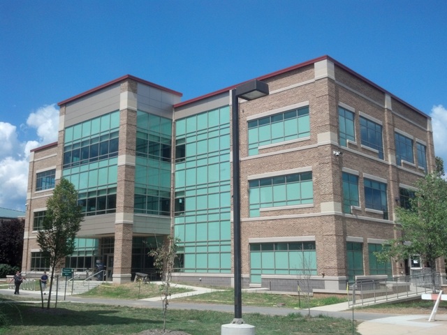 a large building with a lot of windows on the side of it